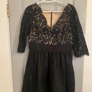 Black cocktail dress w/ lace on bodice & sleeves